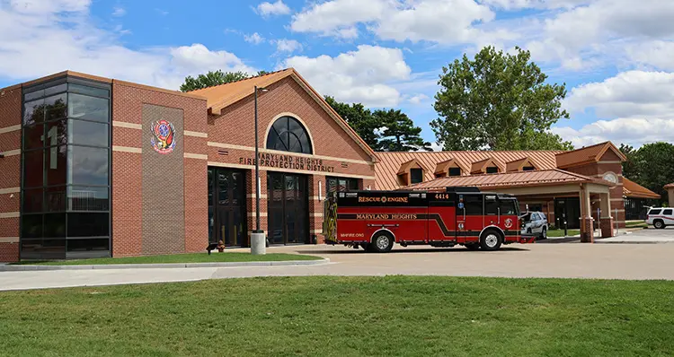 Engine House 1, a two-story brick station on Schuetz Road, with Rescue Engine 4414 parked out front