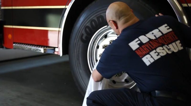 Firefighter keeping the truck clean and ready to roll